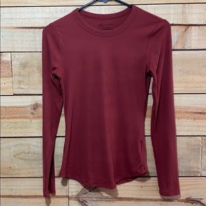 Women’s orange long sleeve shirt.